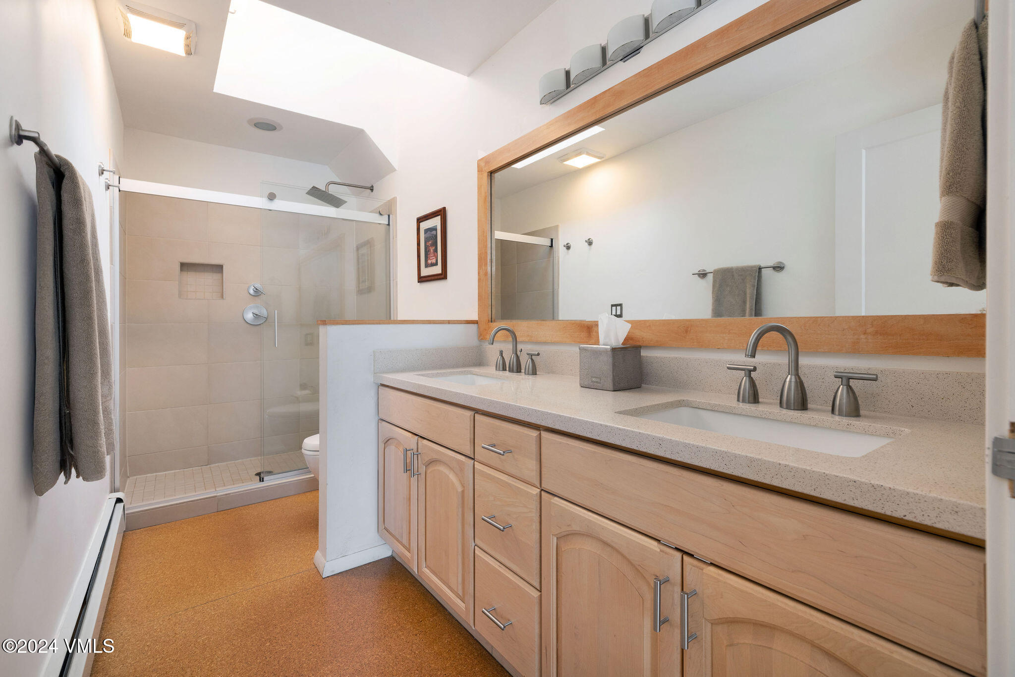 16 Eagle-Vail Road, Unit A3 Eagle-Vail, CO 81620 - Photo 9 of 24 a en suite bathroom with double sink and a large mirror