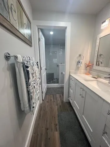 a bathroom with a double vanity sink and mirror