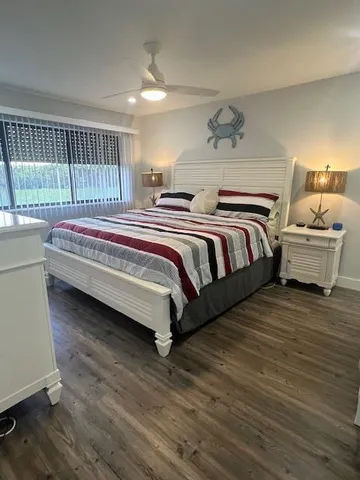 a spacious bedroom with a bed and window