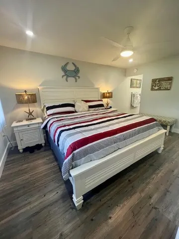 a bedroom with bed and a night stand