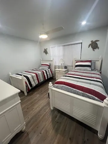 a bedroom with bed and window