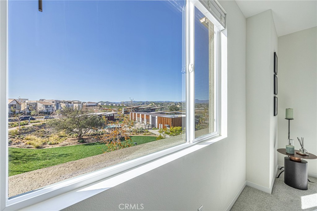 27555 Sanctuary Court Stevenson Ranch, CA 91381 - Photo 14 of 22 a view of a balcony with an outdoor space and seating