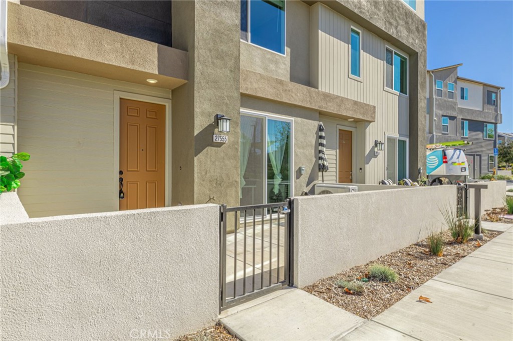 27555 Sanctuary Court Stevenson Ranch, CA 91381 - Photo 2 of 22 a view of a building with a outdoor space