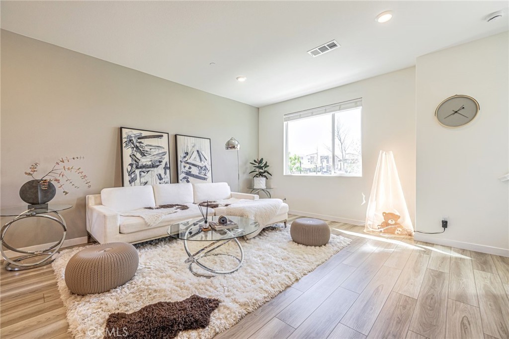 27555 Sanctuary Court Stevenson Ranch, CA 91381 - Photo 5 of 22 a living room with furniture and a window