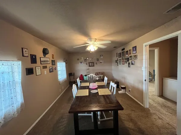 a dining room with furniture and window