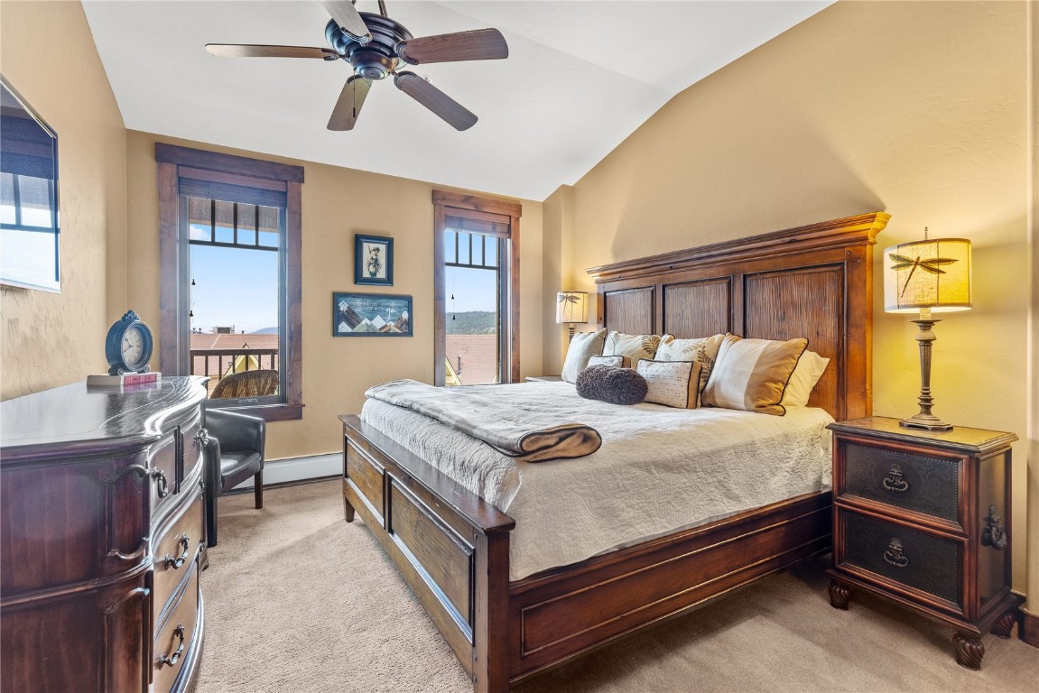 600 Columbine Road, Unit 5407 Breckenridge, CO 80424 - Photo 13 of 29 a bedroom with a bed and wooden cabinets