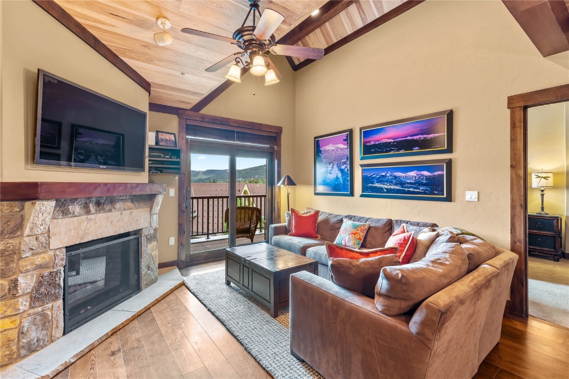 600 Columbine Road, Unit 5407 Breckenridge, CO 80424 - Photo 4 of 29 a living room with furniture fireplace and flat screen tv