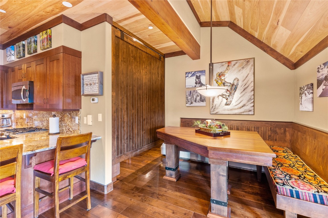 600 Columbine Road, Unit 5407 Breckenridge, CO 80424 - Photo 9 of 29 a backyard of a house with barbeque oven table and chairs