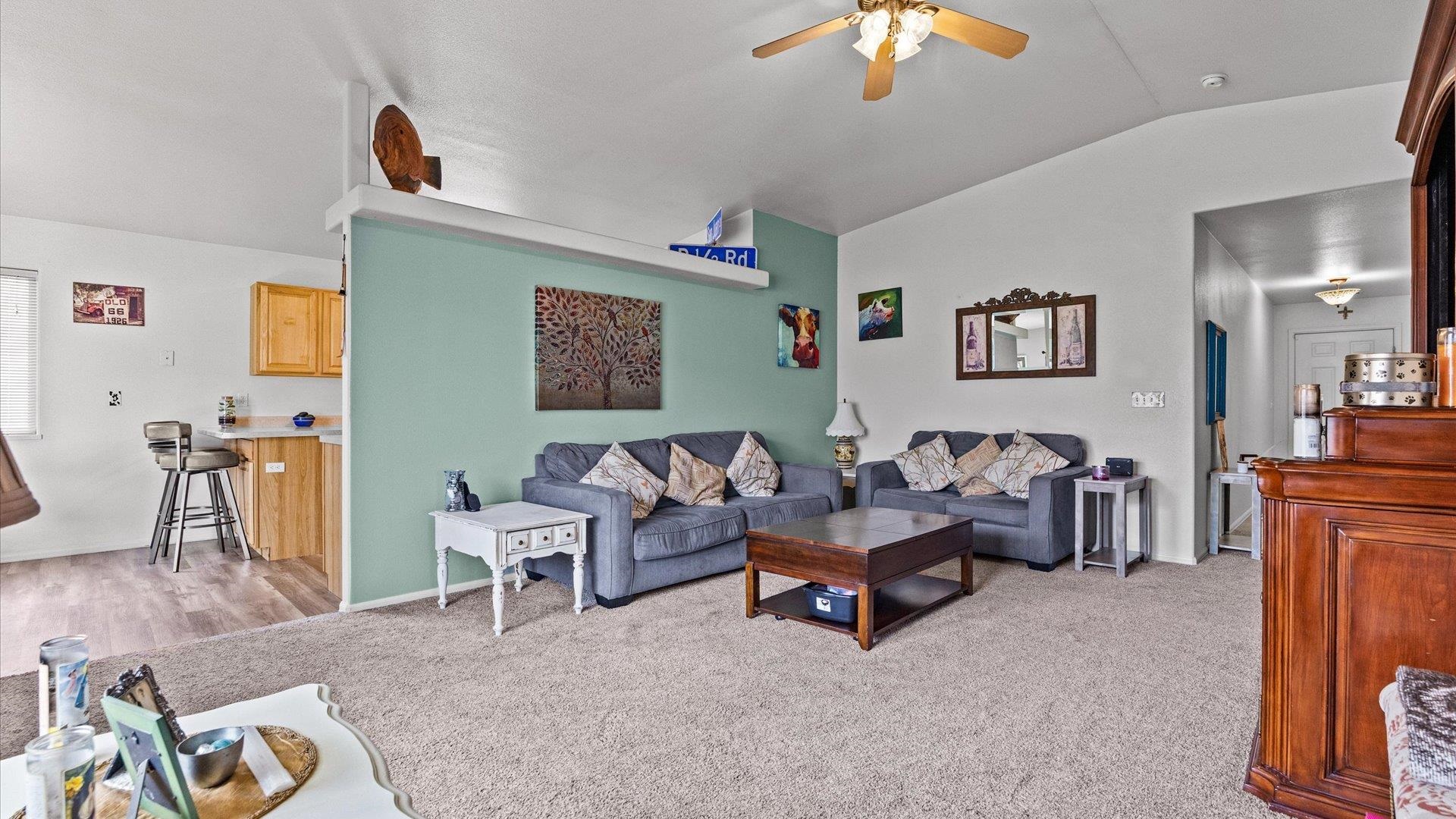 420-29 29 1/2 Road Grand Junction, CO 81504 - Photo 5 of 26 a living room with furniture and a chandelier