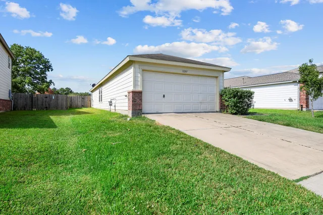 a backyard of a house with lots of green space