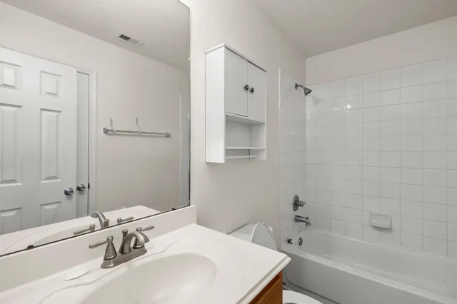 a bathroom with a sink and a bathtub