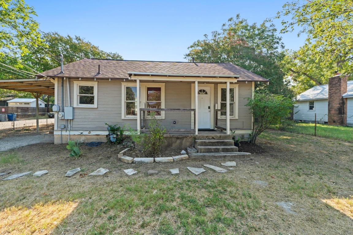 1147 Gunter Street Austin, TX 78721 - Photo 1 of 25 a front view of a house with a yard