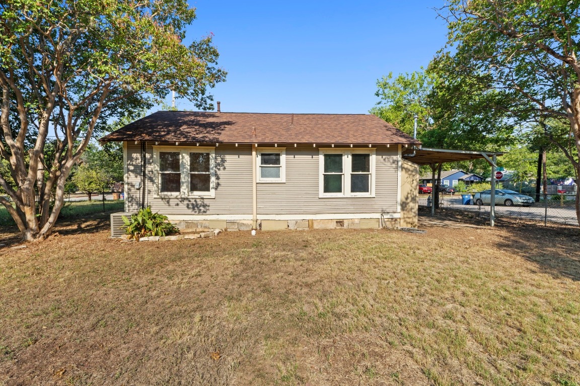 1147 Gunter Street Austin, TX 78721 - Photo 14 of 25 a house with trees in the background