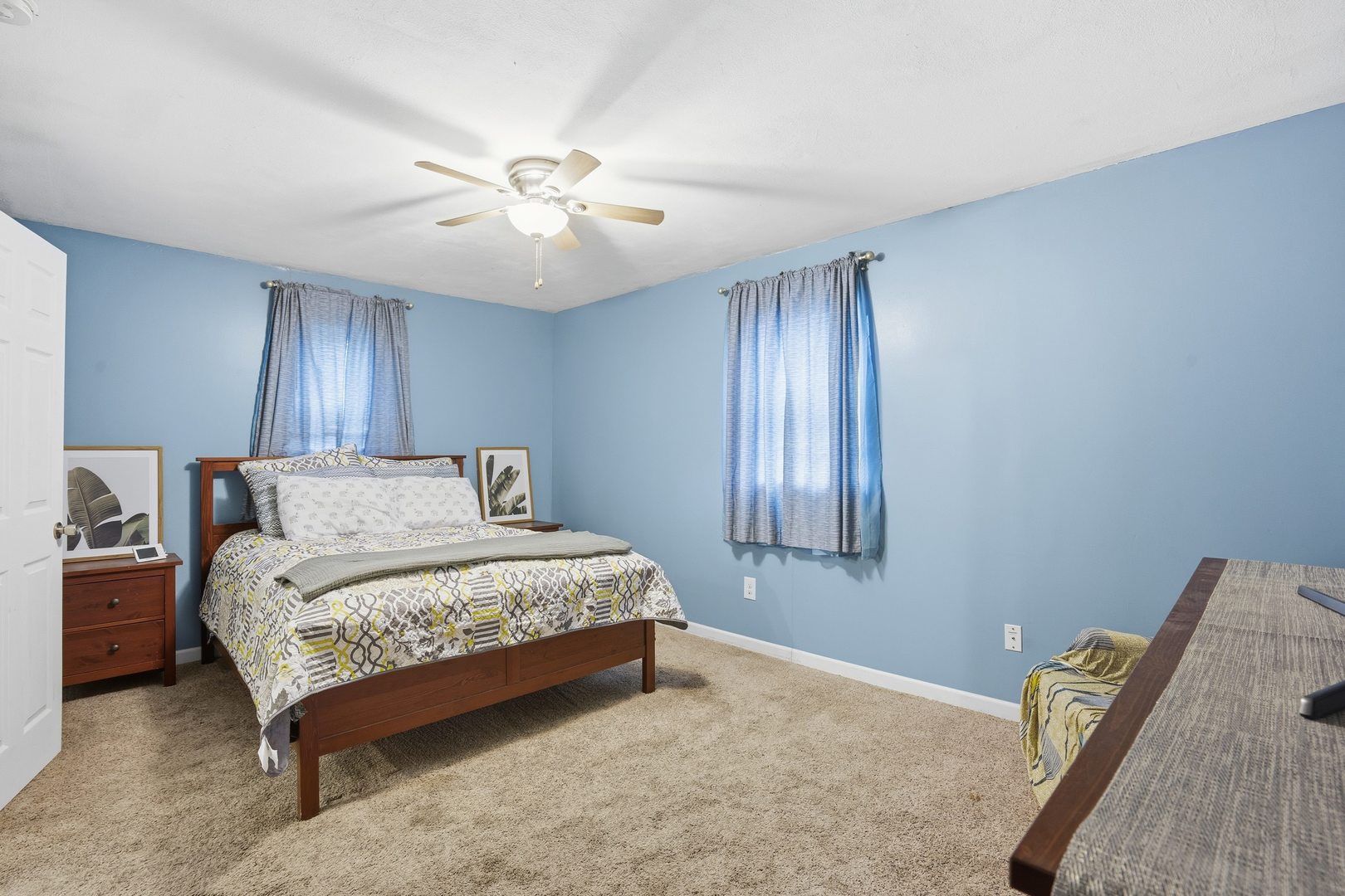 1532 30th Street Rock Island, IL 61201 - Photo 15 of 18 a bedroom with a bed and a chandelier