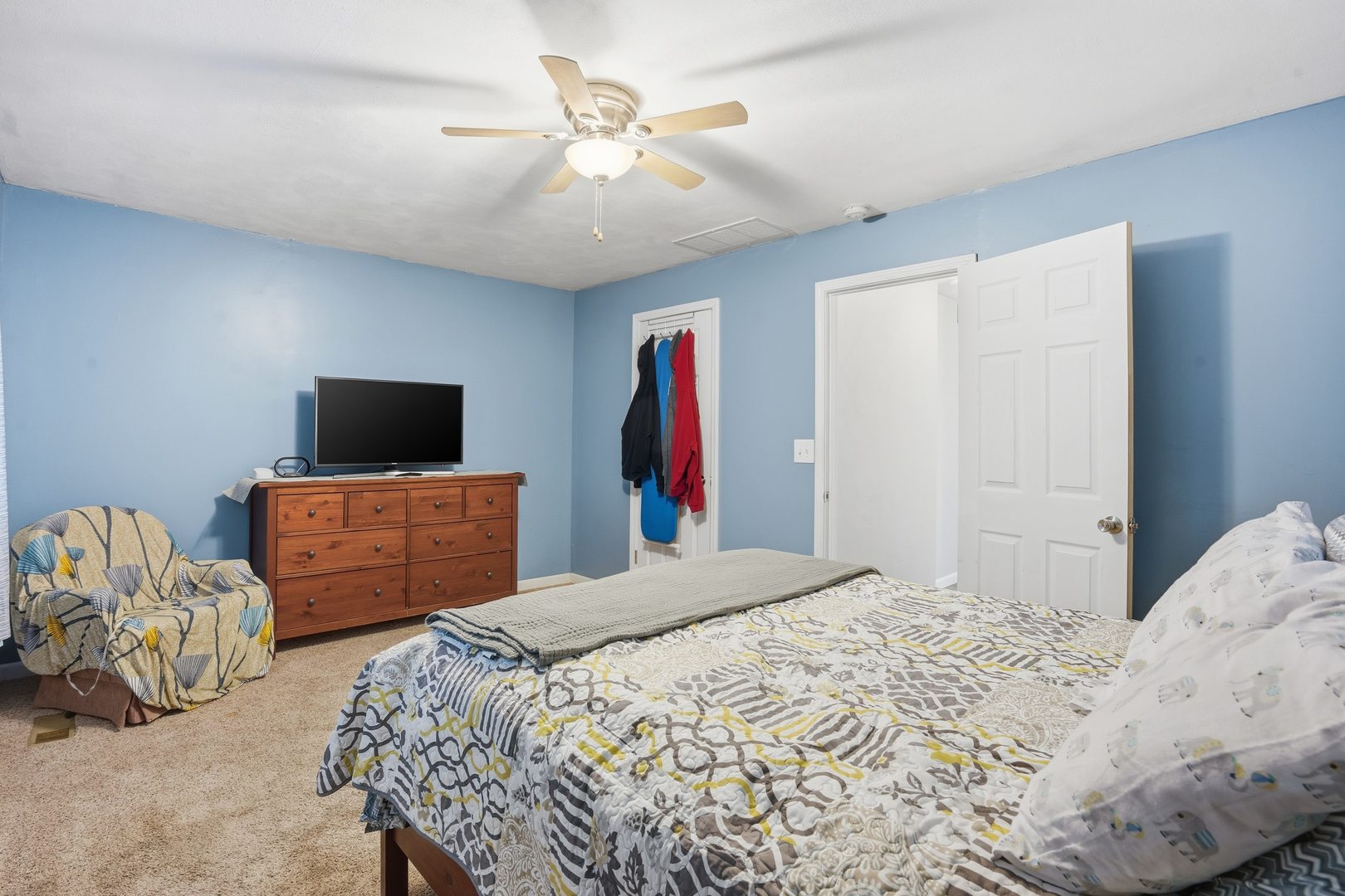 1532 30th Street Rock Island, IL 61201 - Photo 16 of 18 a bedroom with a bed and a flat screen tv