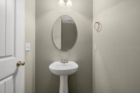 a bathroom with a sink and mirror