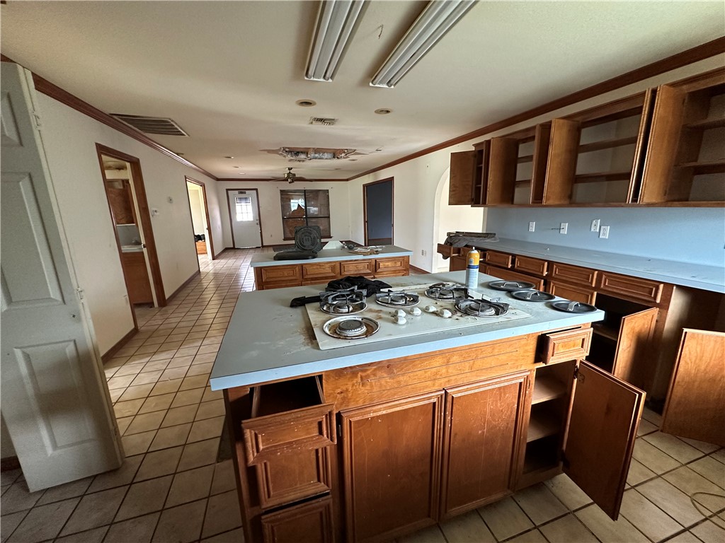 417 Linnet Courts Corpus Christi, TX 78418 - Photo 9 of 20 a kitchen with stainless steel appliances granite countertop a stove and a sink