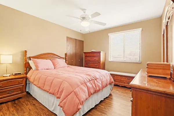 a bedroom with a bed and window