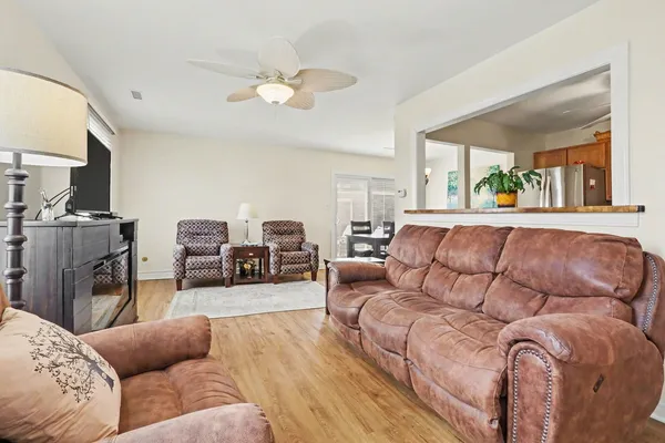 a living room with furniture fireplace and flat screen tv
