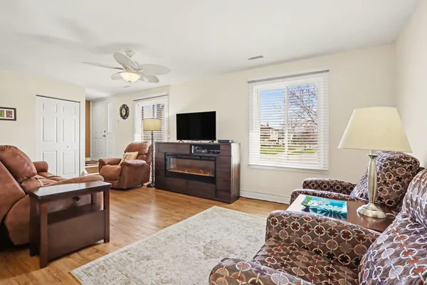 a bedroom with furniture and a flat screen tv