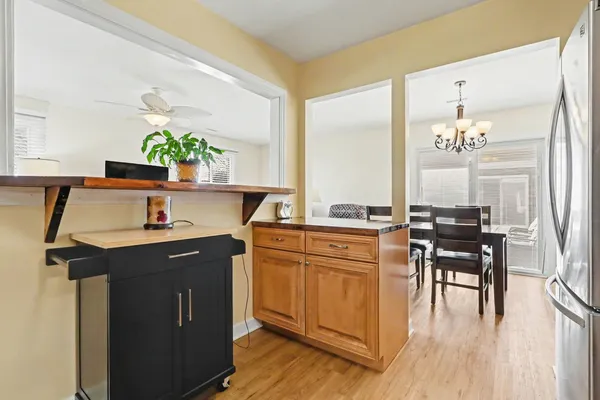 a living room with granite countertop furniture a dining table and chairs