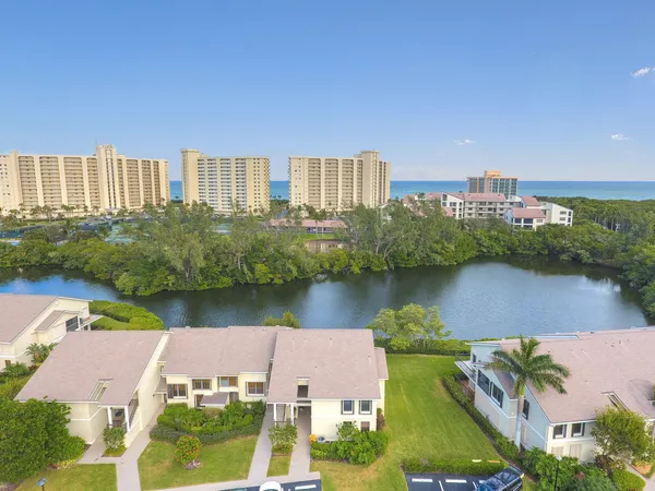 an aerial view of a house with a lake view
