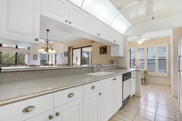 a kitchen with a sink and cabinets