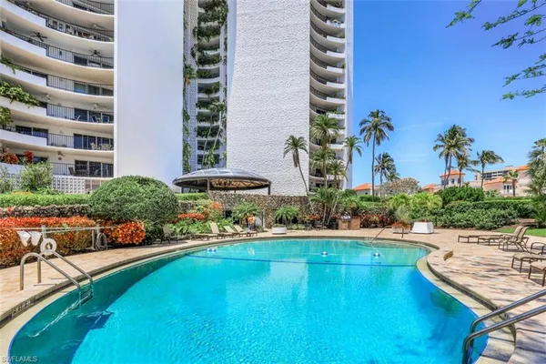 a view of a swimming pool and a chairs