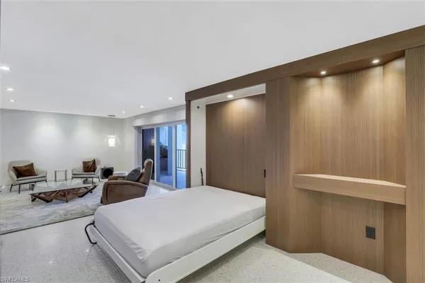a kitchen with a table chairs stove and cabinets