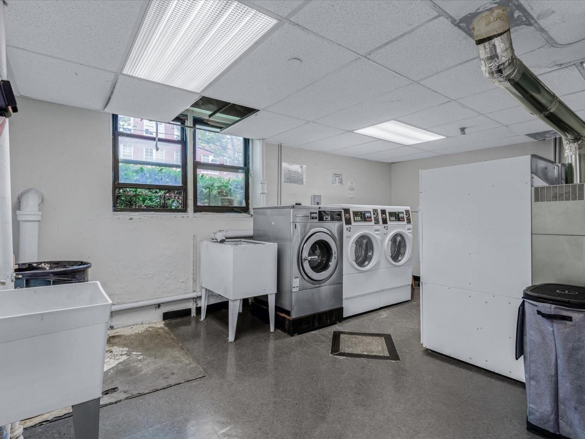 102-12 65th Avenue, Unit D22 Queens, NY 11375 - Photo 11 of 12 a utility room with dryer and washer