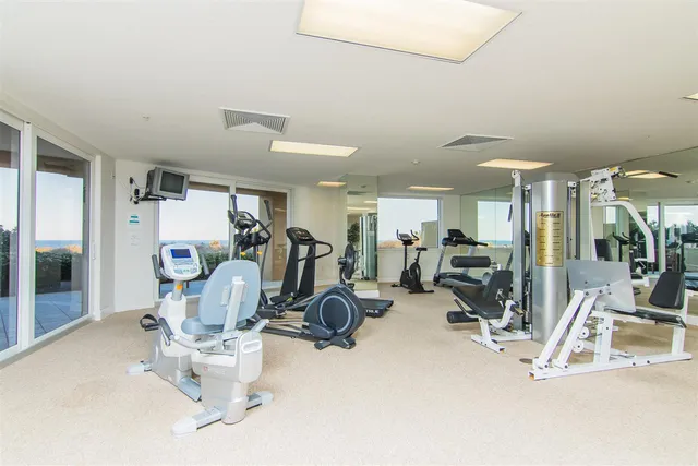 a view of a chairs and table in a balcony