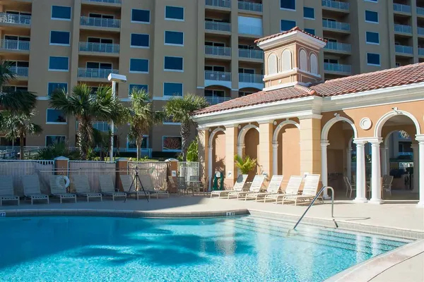 a view of a swimming pool with a patio