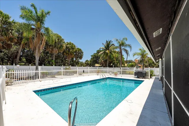 a view of a house with backyard and deck