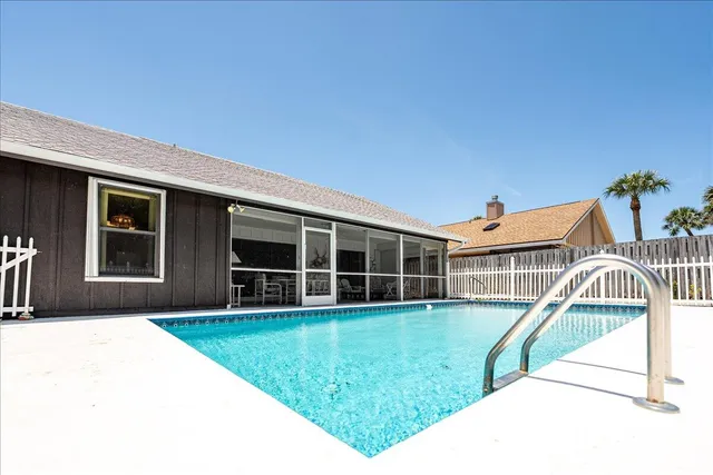 a view of a swimming pool with a patio