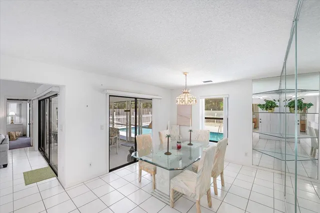 a spacious bedroom with a bed and a flat screen tv