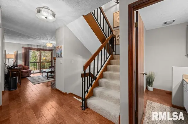 a bathroom with a sink a potted plant and a mirror