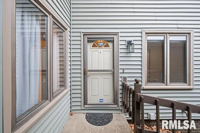 a view of a entryway door front of a house