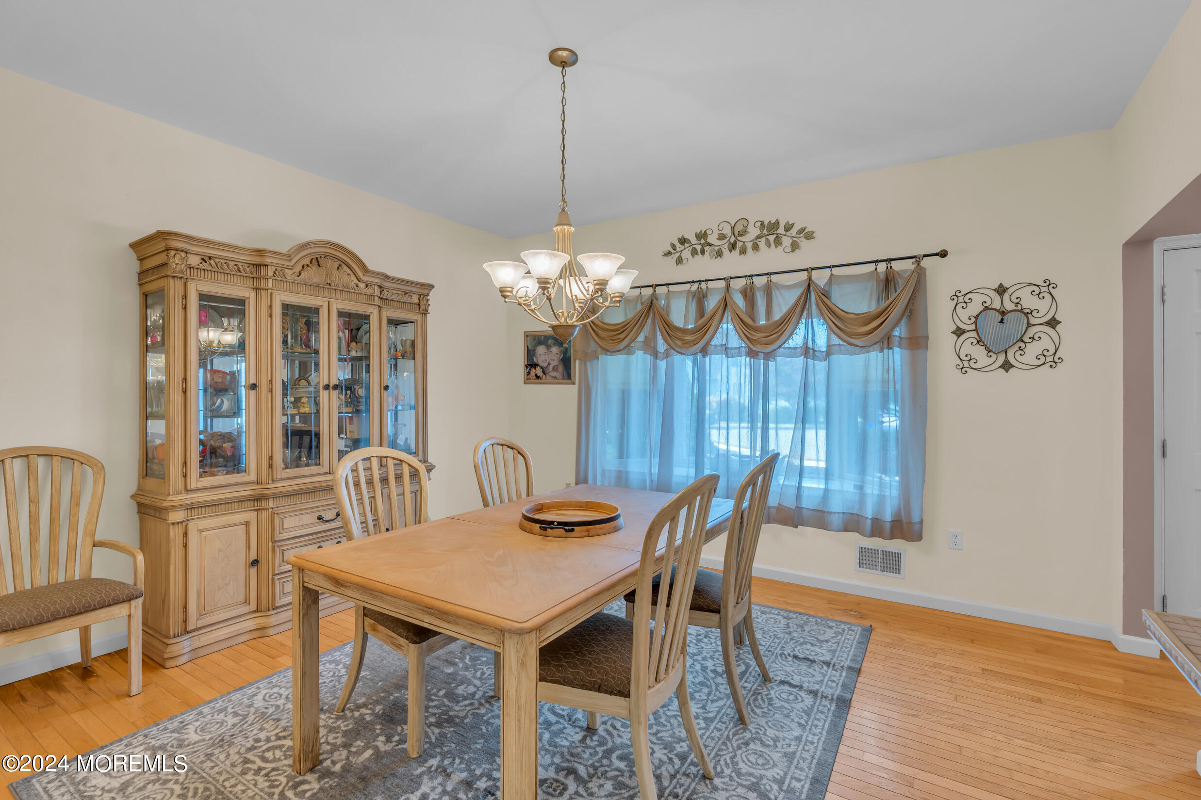 24 Ryjac Court Brick, NJ 08724 - Photo 12 of 57 a view of a dining room with furniture and wooden floor