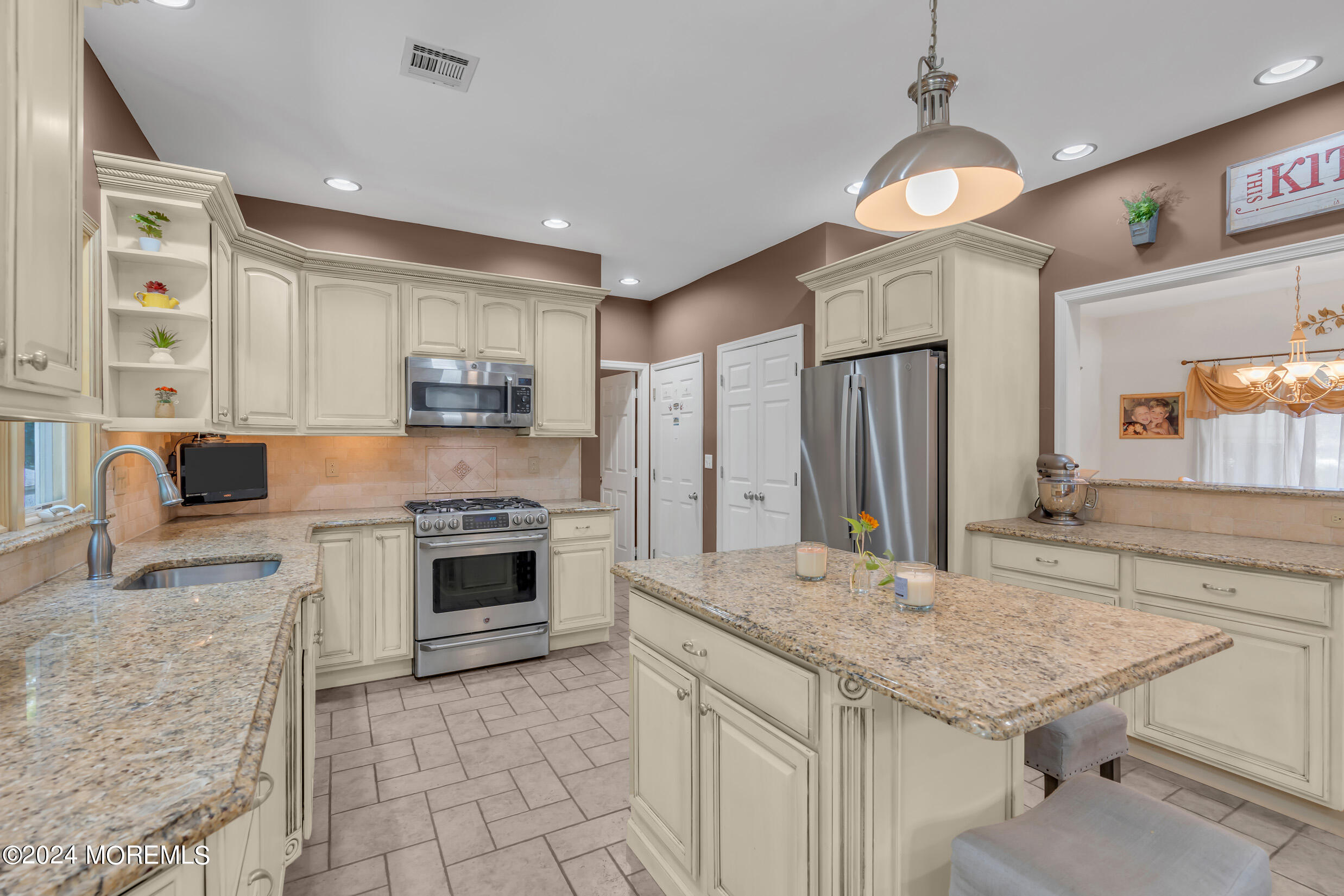 24 Ryjac Court Brick, NJ 08724 - Photo 16 of 57 a kitchen with stainless steel appliances granite countertop a stove and a sink
