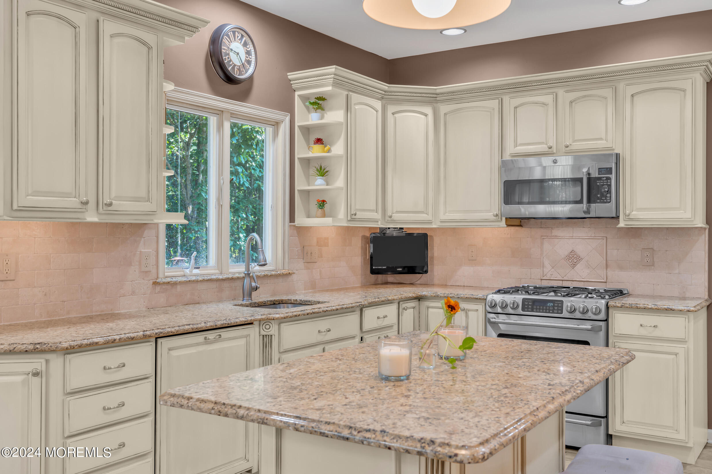 24 Ryjac Court Brick, NJ 08724 - Photo 18 of 57 a kitchen with granite countertop a sink a stove and cabinets