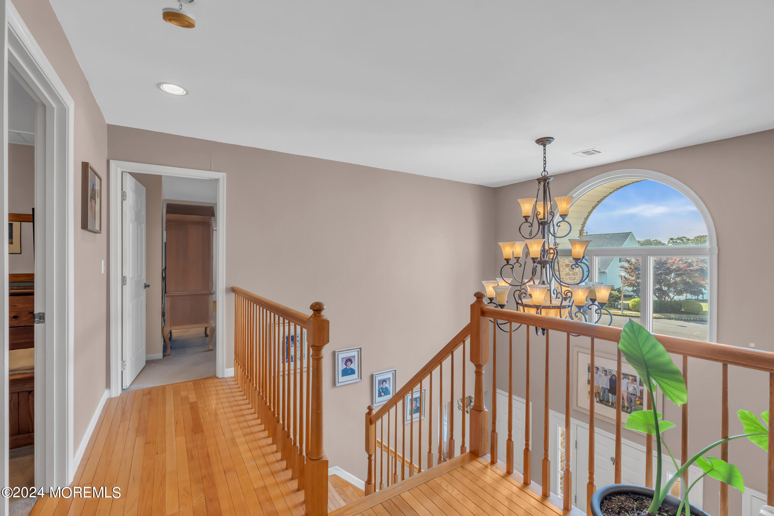 24 Ryjac Court Brick, NJ 08724 - Photo 28 of 57 a view of a hallway view with wooden floor and windows