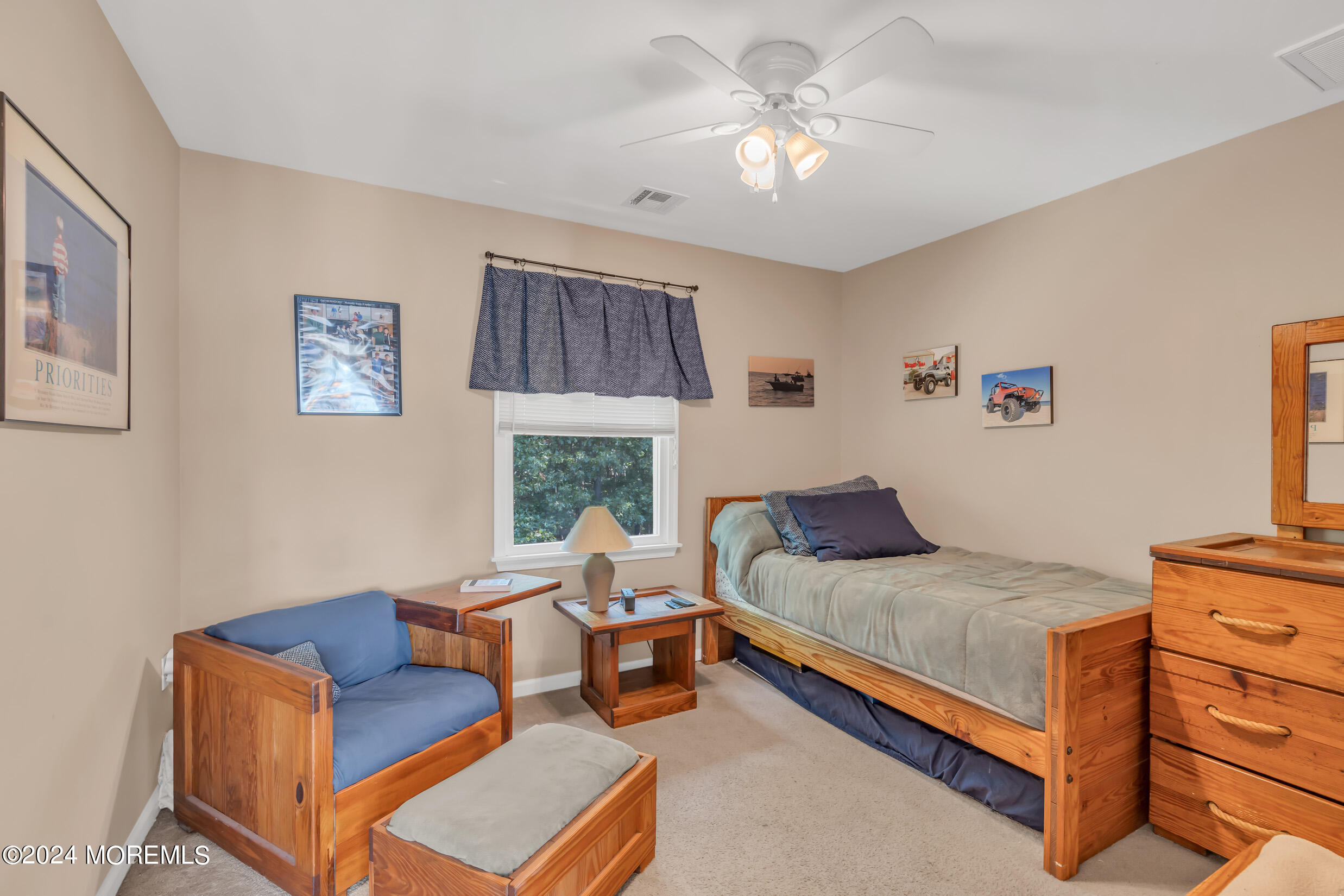 24 Ryjac Court Brick, NJ 08724 - Photo 36 of 57 a bedroom with a bed and a chandelier