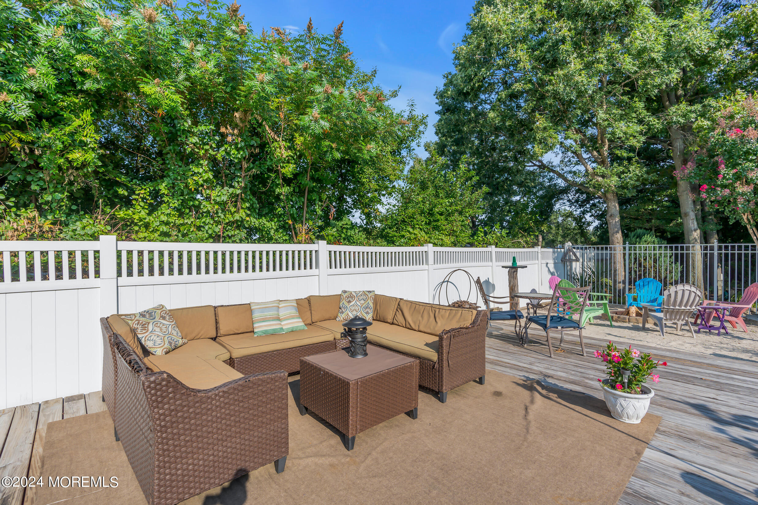 24 Ryjac Court Brick, NJ 08724 - Photo 43 of 57 an outdoor sitting area with furniture and garden