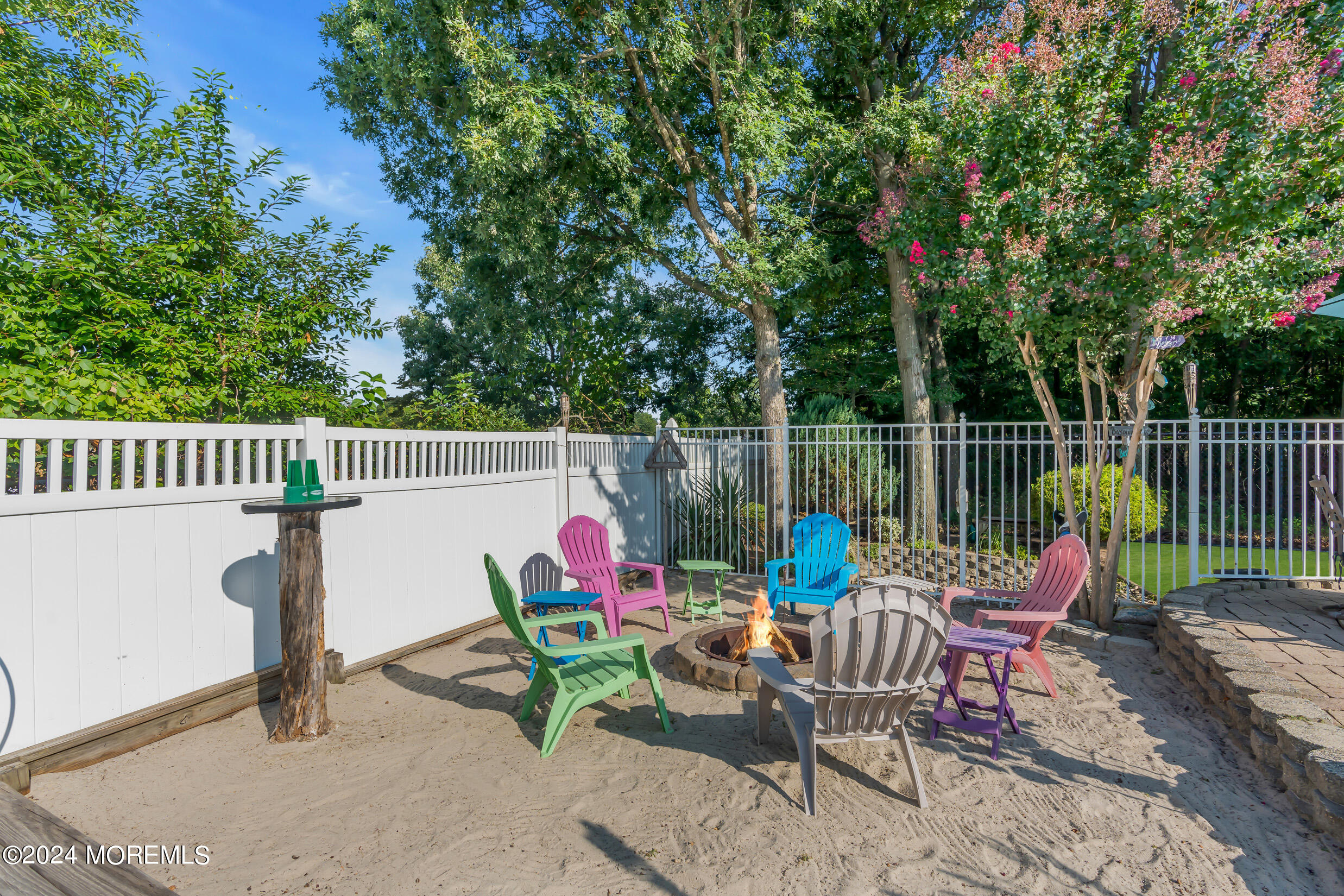 24 Ryjac Court Brick, NJ 08724 - Photo 44 of 57 a view of a patio with two chairs and a table