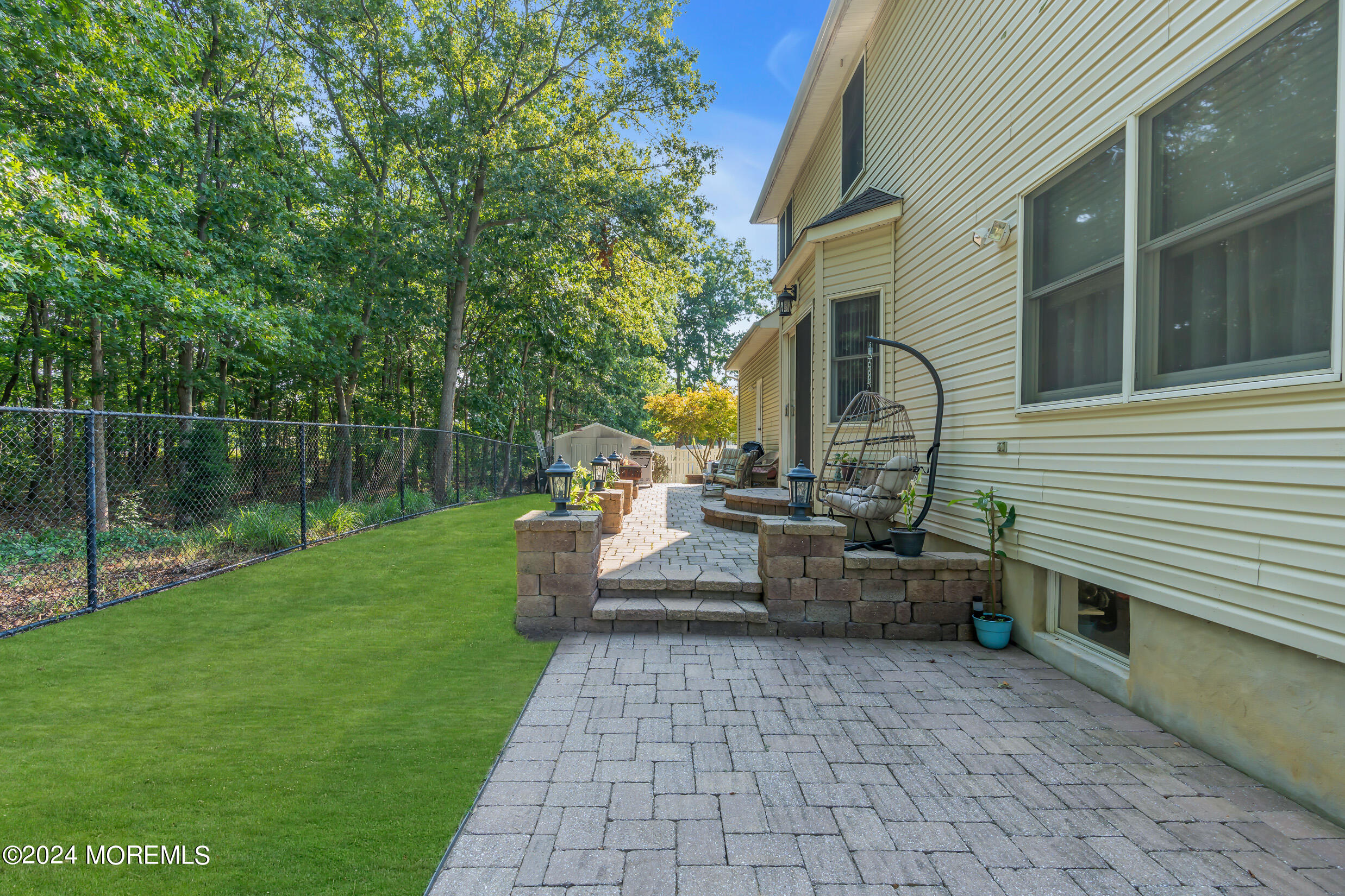 24 Ryjac Court Brick, NJ 08724 - Photo 47 of 57 a view of a patio with couches chairs and potted plants