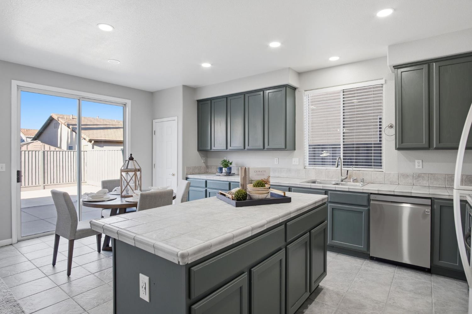 2403 Clemente Lane Tracy, CA 95377 - Photo 11 of 43 a kitchen with a sink a counter top space and appliances