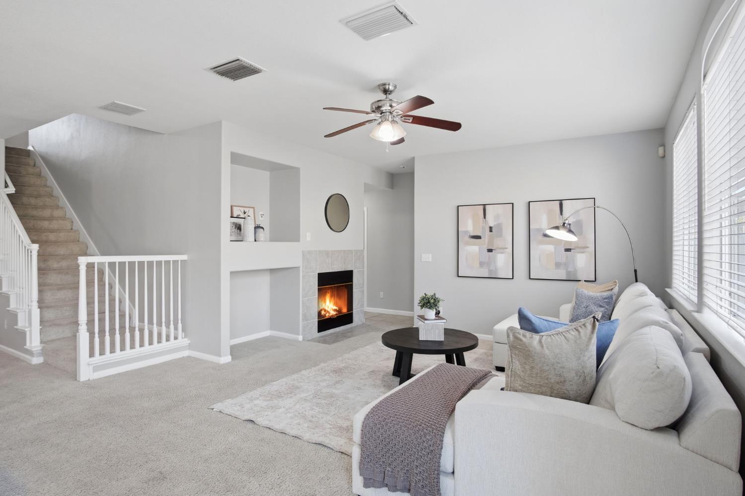 2403 Clemente Lane Tracy, CA 95377 - Photo 14 of 43 a bedroom with furniture and a fireplace
