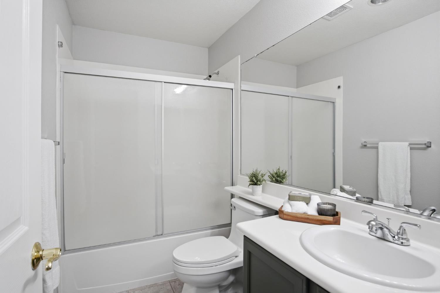 2403 Clemente Lane Tracy, CA 95377 - Photo 16 of 43 a bathroom with a sink toilet and shower