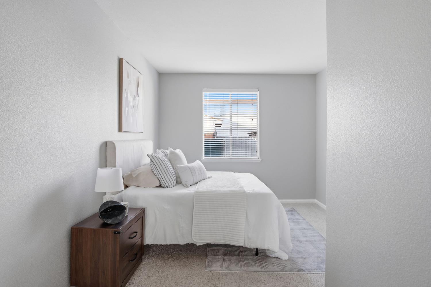 2403 Clemente Lane Tracy, CA 95377 - Photo 17 of 43 a bedroom with a bed and a window