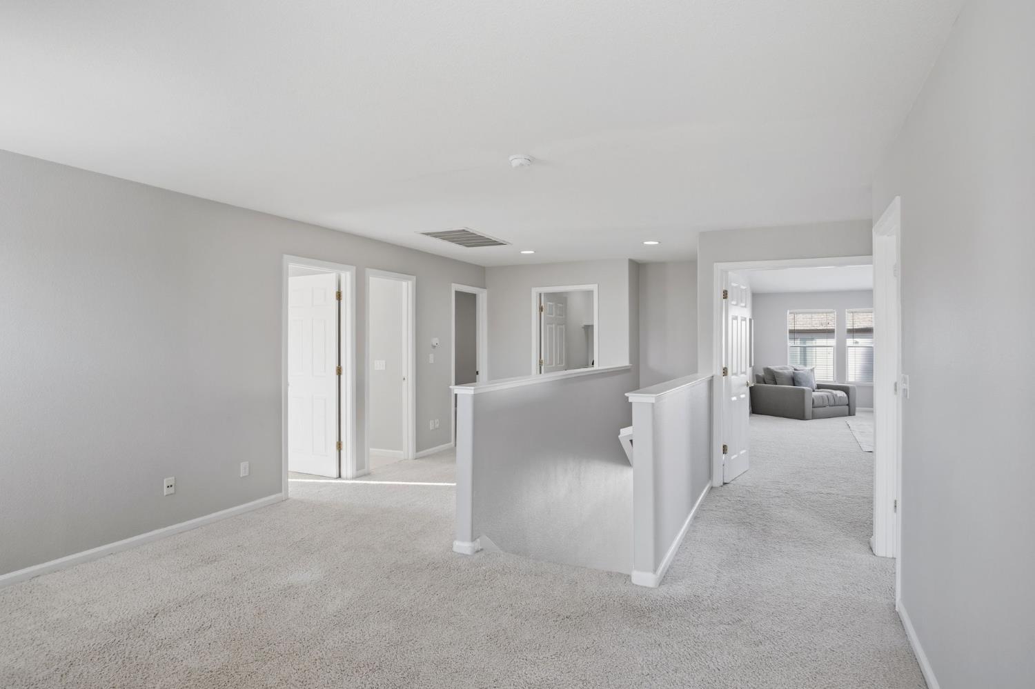 2403 Clemente Lane Tracy, CA 95377 - Photo 19 of 43 a view of a big room with windows and chandelier